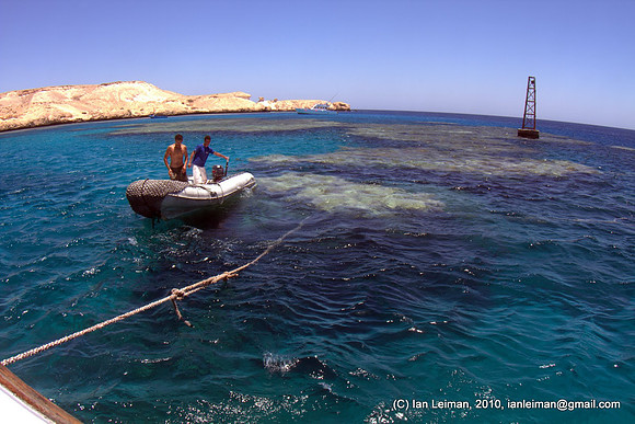 the boat crew prepares to detach the boat and we head for the next site