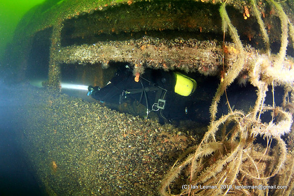 left side, below the bridge